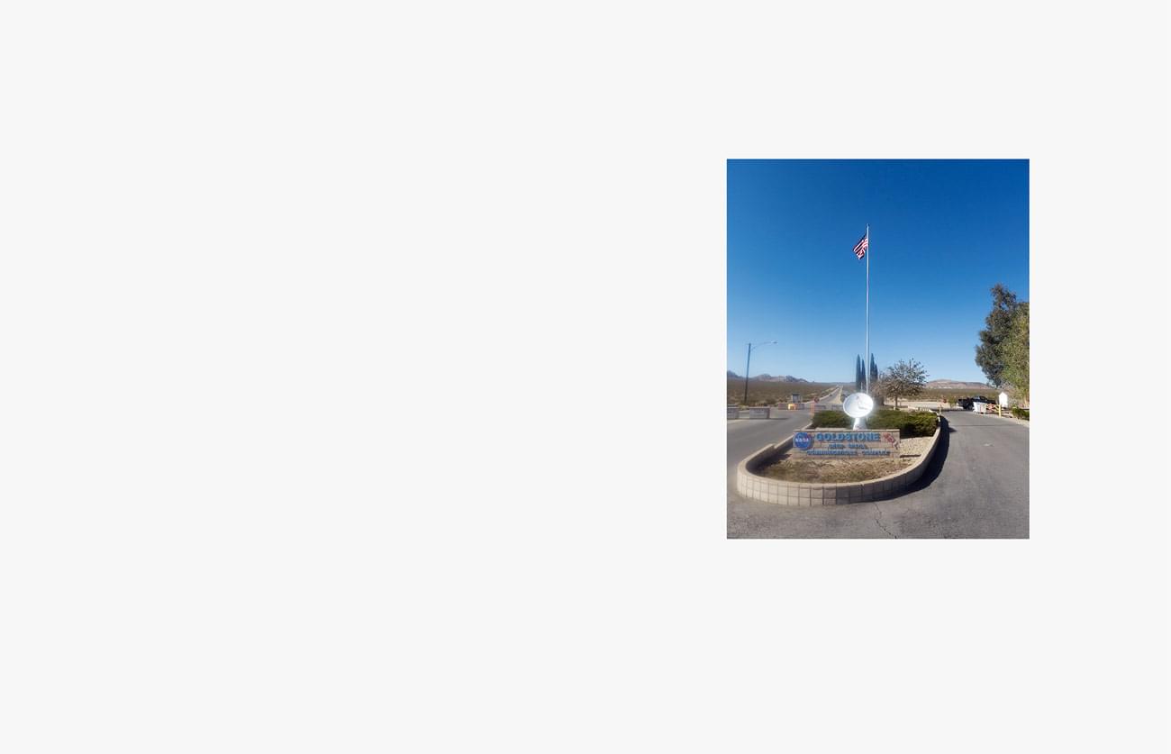 Voyager – The Grand Tour - At the Goldstone Deep Space Communication Complex, one of the three sites of the Deep Space Network, radio contact with JPL spacecraft is maintained. Entrance gate. GATE.